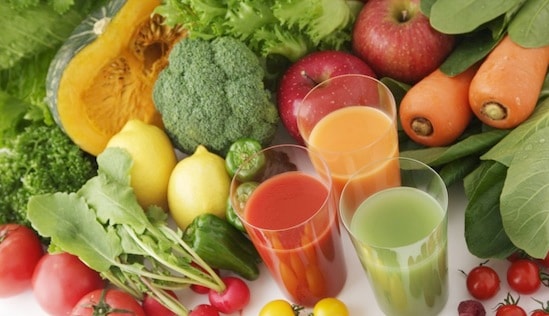 Fresh raw whole foods — vegetables, fruits and grains